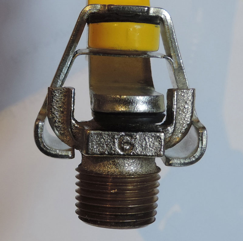 Shutgun with sheared head attachment on water sprinkler for emergency fire sprinkler shut off