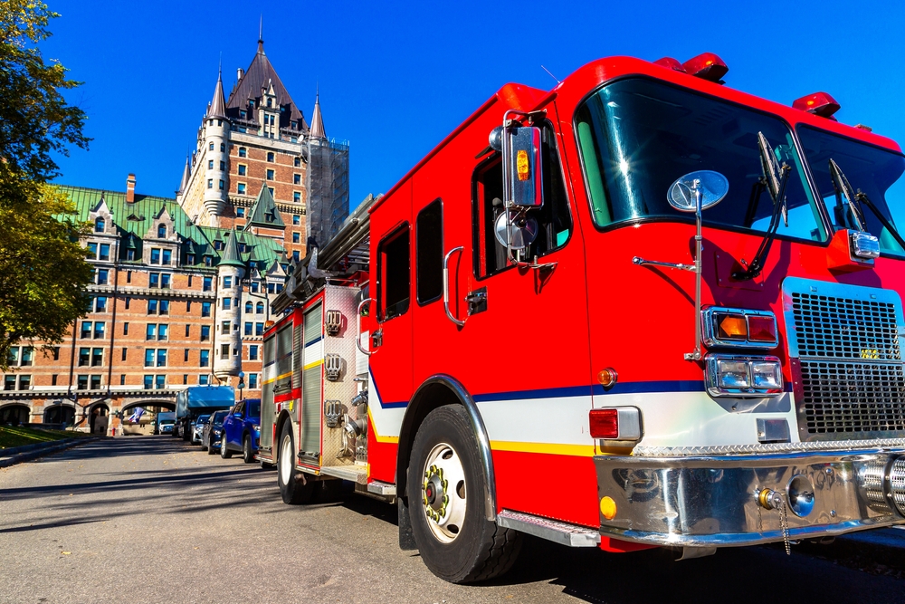 fire engine truck parked near frontenac castle