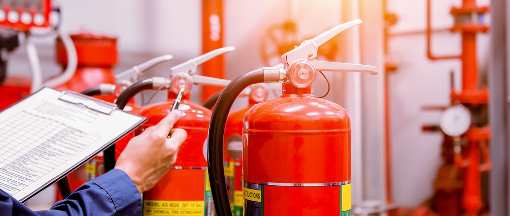 engineer checking fire alarm system