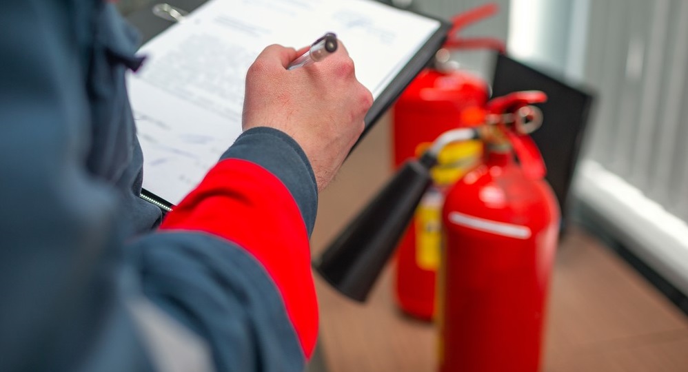 engineer professional checking fire extinguisher