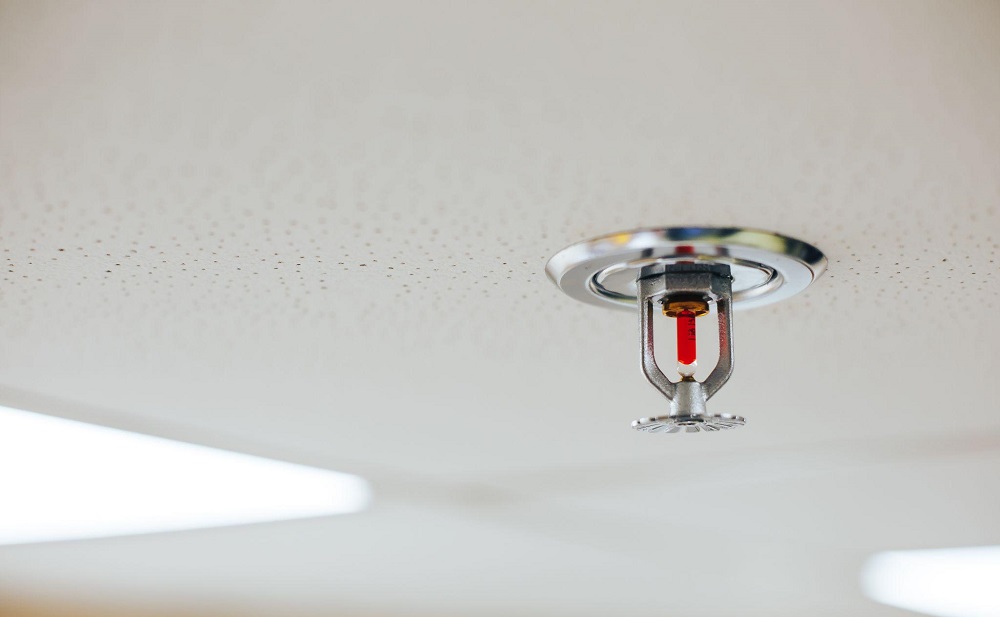Fire sprinkler on a white ceiling