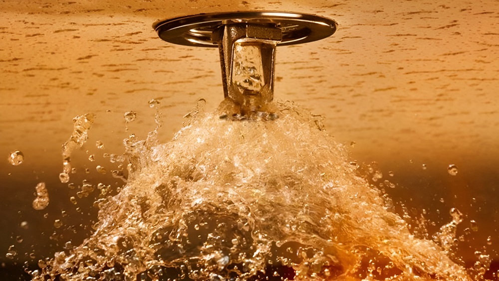 Fire sprinkler head expelling water PC