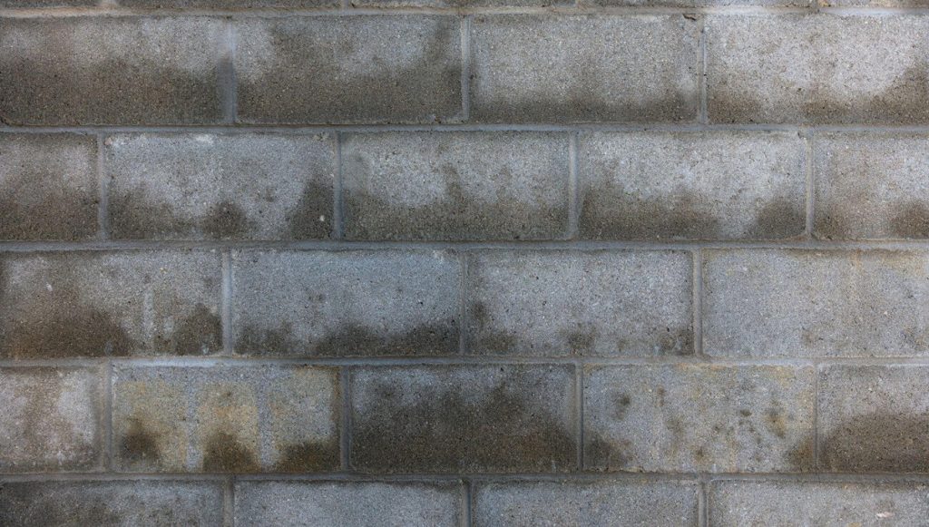 Concrete wall with water damage